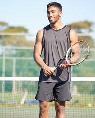 Playing, happy or Indian man on tennis court for fitness training, workout or sports exercise outdoors. Wellness, thinking and healthy athlete with smile or racket to start challenge in game or match