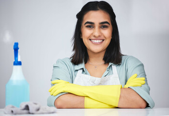 Portrait, Indian woman and cleaner with smile or spray bottle for table, counter or dirty furniture...