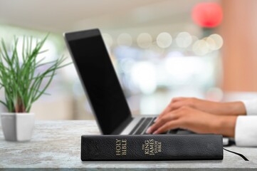 Christian online concept. computer laptop and bible book