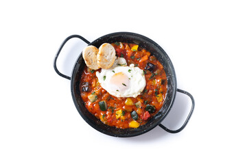Vegetable pisto manchego with tomatoes, zucchini, peppers, onions,eggplant and egg, served in frying pan isolated on white background - 792589930