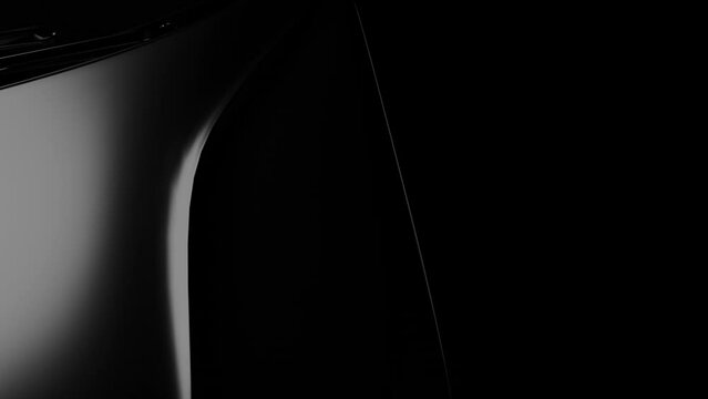 the view of the black car from above, the glare of the light illuminates the car body