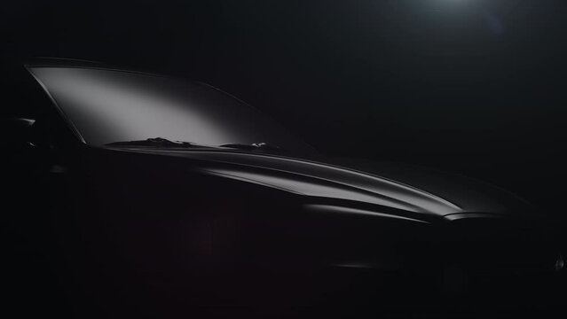 a black car with a dynamic backlight that forms glare on the car body