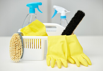 Table, brush or basket with cleaning supplies, spray bottle or chemical for bacteria, wellness or...