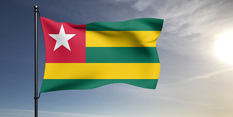 Togo national flag cloth fabric waving on beautiful grey sky Background.