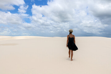 person walking on the beach