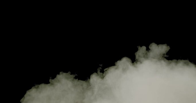 FX element of fog rolling toward camera, shot against black, filling the frame. Small in scale. Resolution: 4096 x 2160 @ 24fps