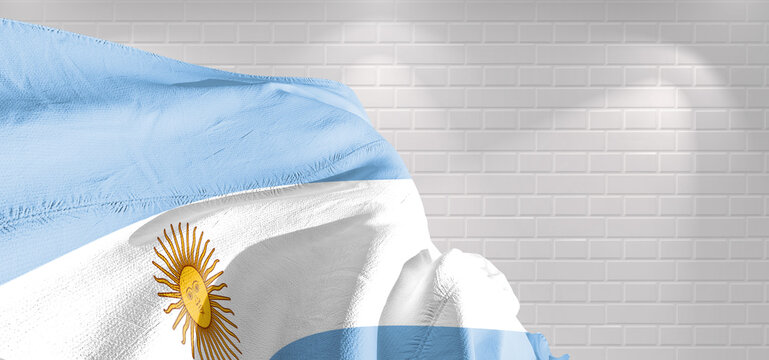 Argentina national flag cloth fabric waving on beautiful bricks Background.	
