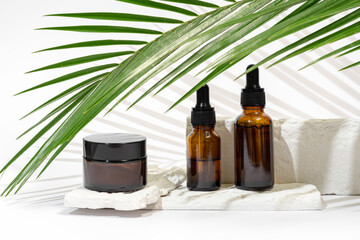 Eco-friendly cosmetic packaging with natural palm leaf backdrop