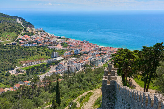 aerial view over city of Sesimbra with atlantic ocean in background