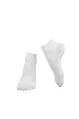 Close-up shot of a pair of women's white mesh socks with an openwork pattern. Ankle cut fishnet socks with reinforced heel and toe are isolated on a white background. Front view.