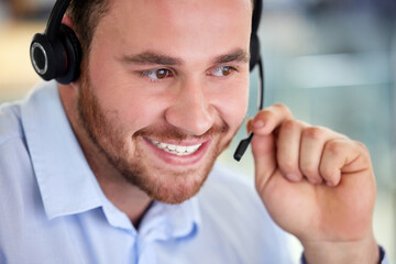 Call center, happy and man on mic for listening, support or customer service for business. Face,...
