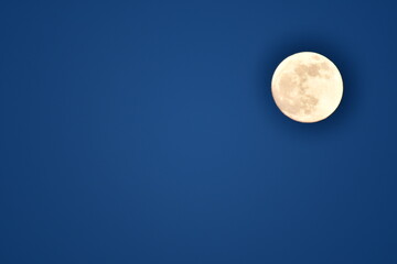Naklejka na ściany i meble Full moon on blue sky beautifull background