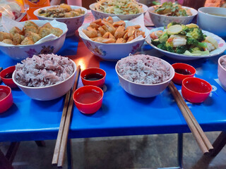 Food on the table for gods worshiping Chinese in the China New Year.