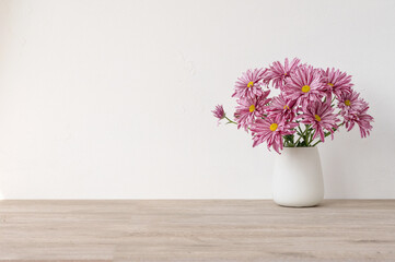 Minimalist floral product background with empty copy space, wooden beige neutral table, white...