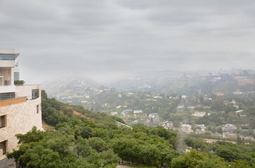 Fototapeta na wymiar Los Angeles in the Fog The Magic of City Contours Foggy morning landscape picturesque houses on the hills