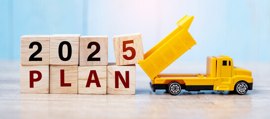 2025 Plan cube blocks with miniature truck or construction vehicle. New Start, Vision, Resolution,...