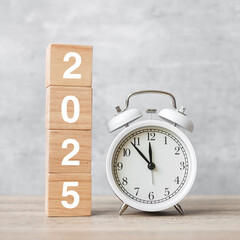 Happy New Year with vintage alarm clock and 2025  block. Christmas, New Start, Resolution,...