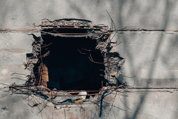 hole in the wall of a house from a bomb hit in Ukraine