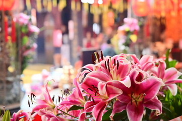 Close-up of lilies offered in Chinese temples by devotees, symbolizing purity, auspiciousness, and...