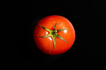 Fresh tomato isolated against black background. Organic tomato, top view - 792633550
