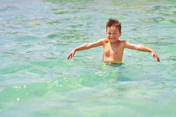 Photo of relaxing vacation in Egypt Hurghada boy entering water - 792636520