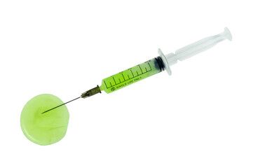 A syringe with a green liquid in it is on a white background.