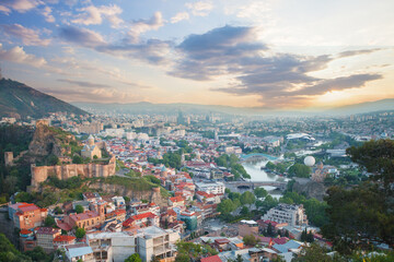 Landscape of old Tbilisi on the background of spectacular blue sky with clouds