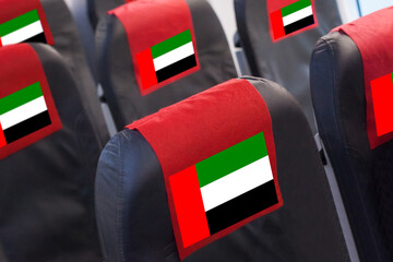 UAE Flag on Empty seat in plane. Travel, flight and transportration in United Arab Emirates concept