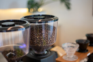 selective focus coffee bean grinder in coffee shop There are tons of coffee pellets all over the...