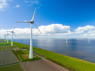 Windmill park in Spring, windmill turbines generating green energy electrically, windmills and...
