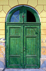 old green door of the historic Villa Mary in the spa town of Bath Voeslau, Austria