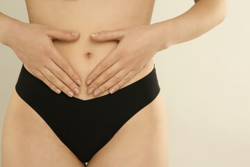 Gynecology. Woman in underwear on light background, closeup