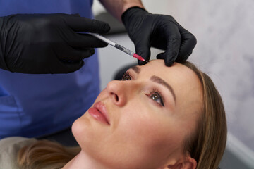 Facelifting procedure in beauty salon