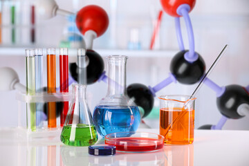 Different glassware and molecule model in laboratory