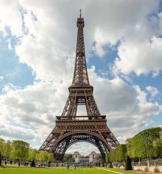 Eiffel Tower in Spring: Paris Landmark on a Partly Cloudy Day