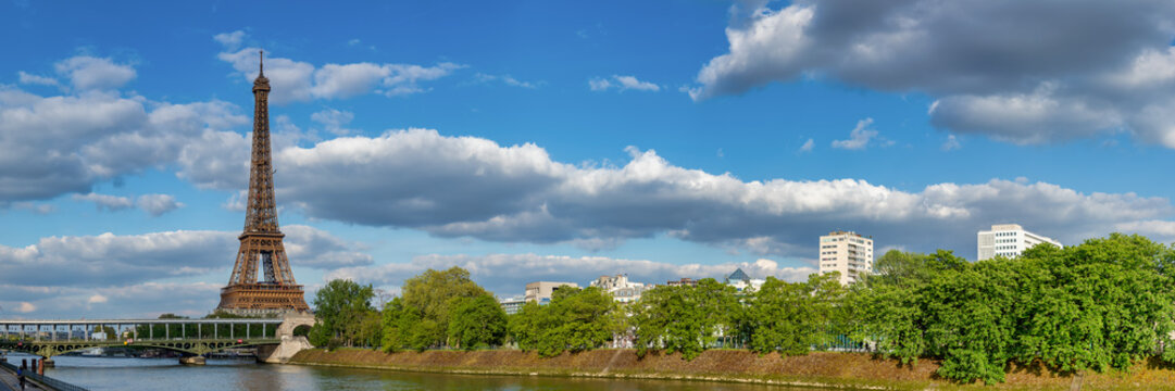 Tranquil Spring Day: River Seine Panorama with Eiffel Tower and Bir Hakeim Bridge