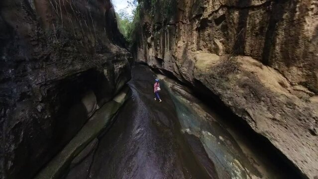 Woman hiking through Hell&rsquo;s gate national park in Kenya