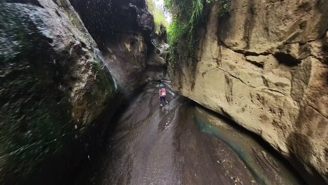 Woman hiking through Hell&rsquo;s gate national park in Kenya