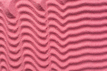 Lines drawn in pink sand background, beautiful sand texture, overhead view of pink sand, zen pattern drawn in the sand, Top view of fine grain texture