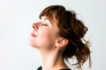 Peaceful woman portrait doing breath exercises.