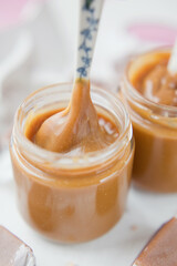 Caramel sauce and spoon close up