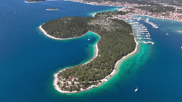 Aerial panoramic video of Rogoznica turquoise bay town and marina, central Dalmatia region of Croatia