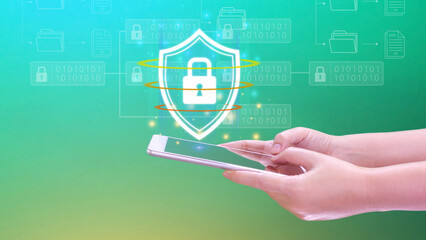Computer network protection, secure and safe your data concept, businessman holding shield protection icon on smartphone, Security shield Lock Security Business Protect Concept.