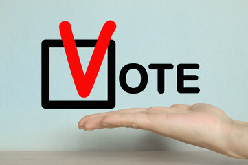 Election vote concept. Icon and Concept.  letters on bright Yellow background. The Hand of a Man