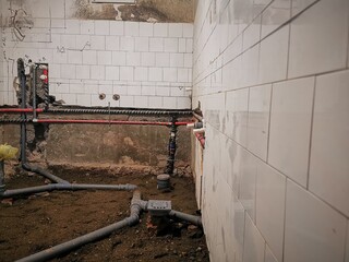 Bathroom construction at renovated home. Installation of supply water pipes and drain sewer pipes...