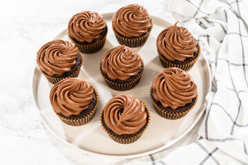 Baking Chocolate Cupcakes with Decadent Chocolate Frosting - 792730725