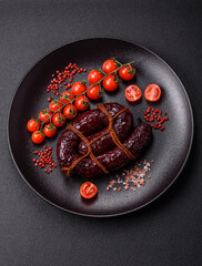 Delicious black blood sausage or black pudding with spices and herbs