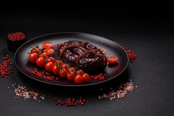 Delicious black blood sausage or black pudding with spices and herbs