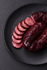 Delicious black blood sausage or black pudding with spices and herbs