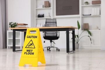 Cleaning service. Wet floor sign in office, space for text